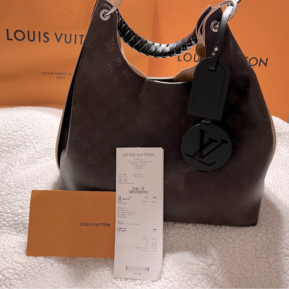 100% Authentic Louis Vuitton Carmel Hobo Bag. Comes with receipt, dust bag, box.